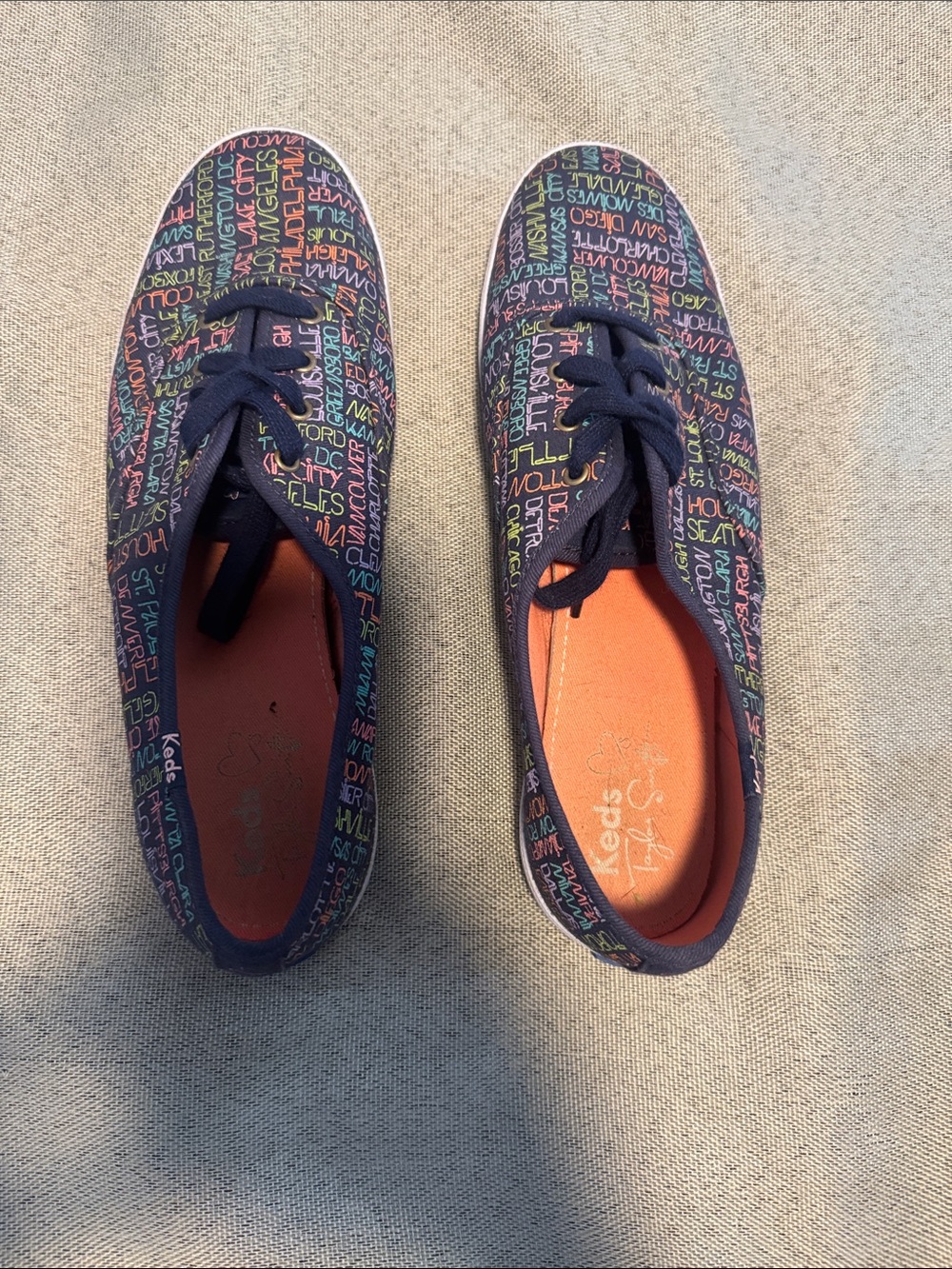 Keds Navy Canvas Sneakers with Multicolor Script and Orange Insole
